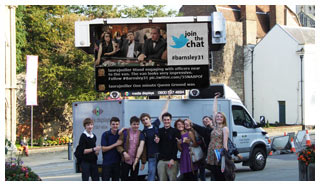 A live Twitter Feed on an outdoor digital advertising screen.