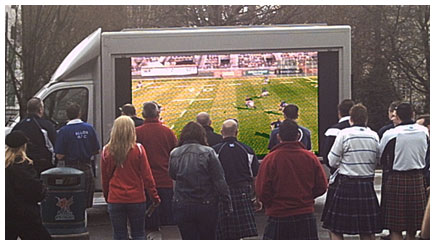 A tv-bike goes off road to target shoppers as they bottle neck in a busy city centre